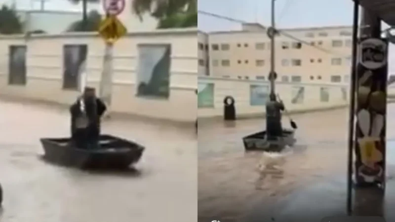 Após chuva forte, homem usa barco para transitar por rua alagada de Caldas Novas; veja vídeo